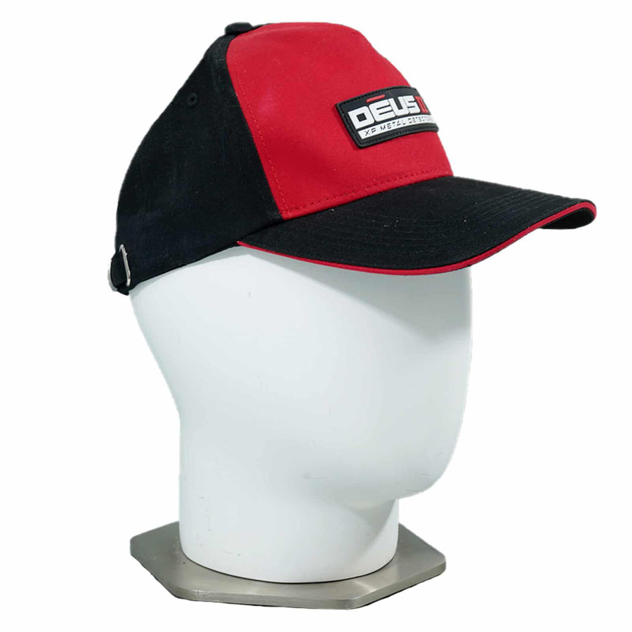 XP Deus II cap displayed with metal detecting equipment