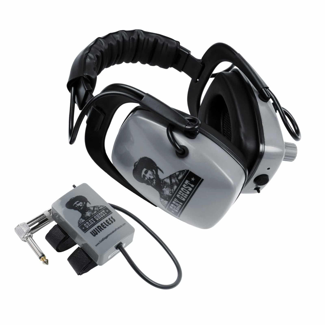 Gray Ghost Wireless Platinum headphones folded beside the 2.4 GHz transmitter with right-angle 1/4 inch plug