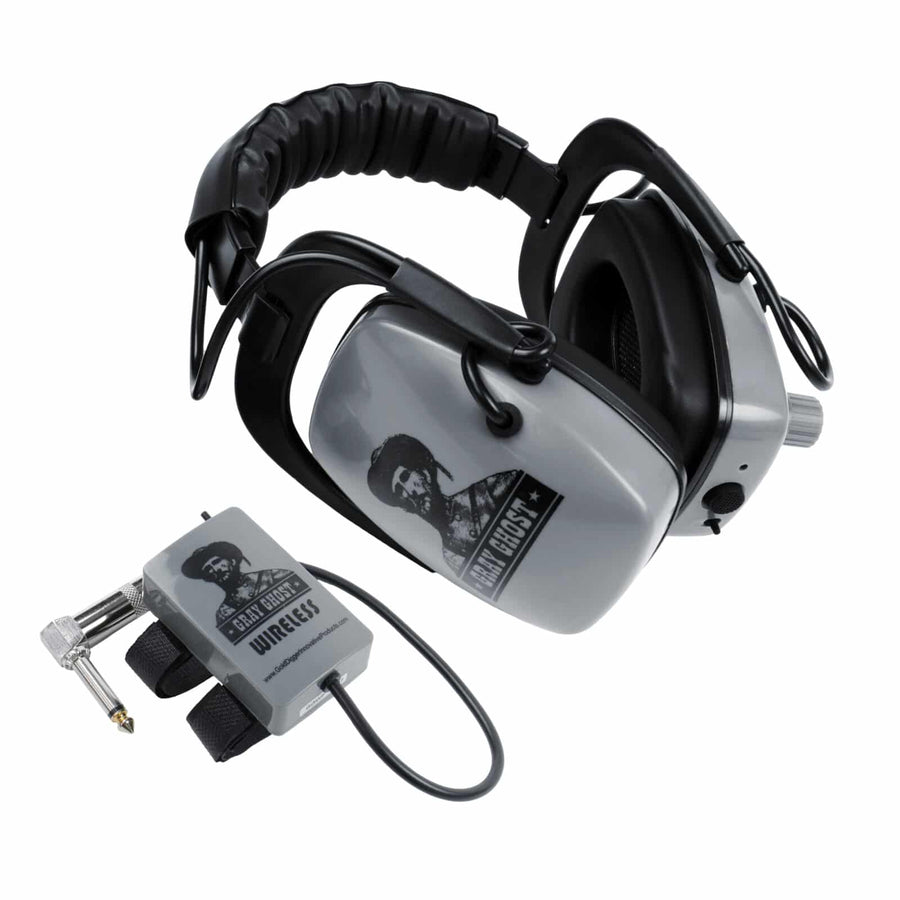 Gray Ghost Wireless Platinum headphones folded beside the 2.4 GHz transmitter with right-angle 1/4 inch plug