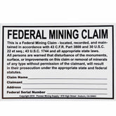 Blue Bowl federal mining claim sign showing white plastic with black text