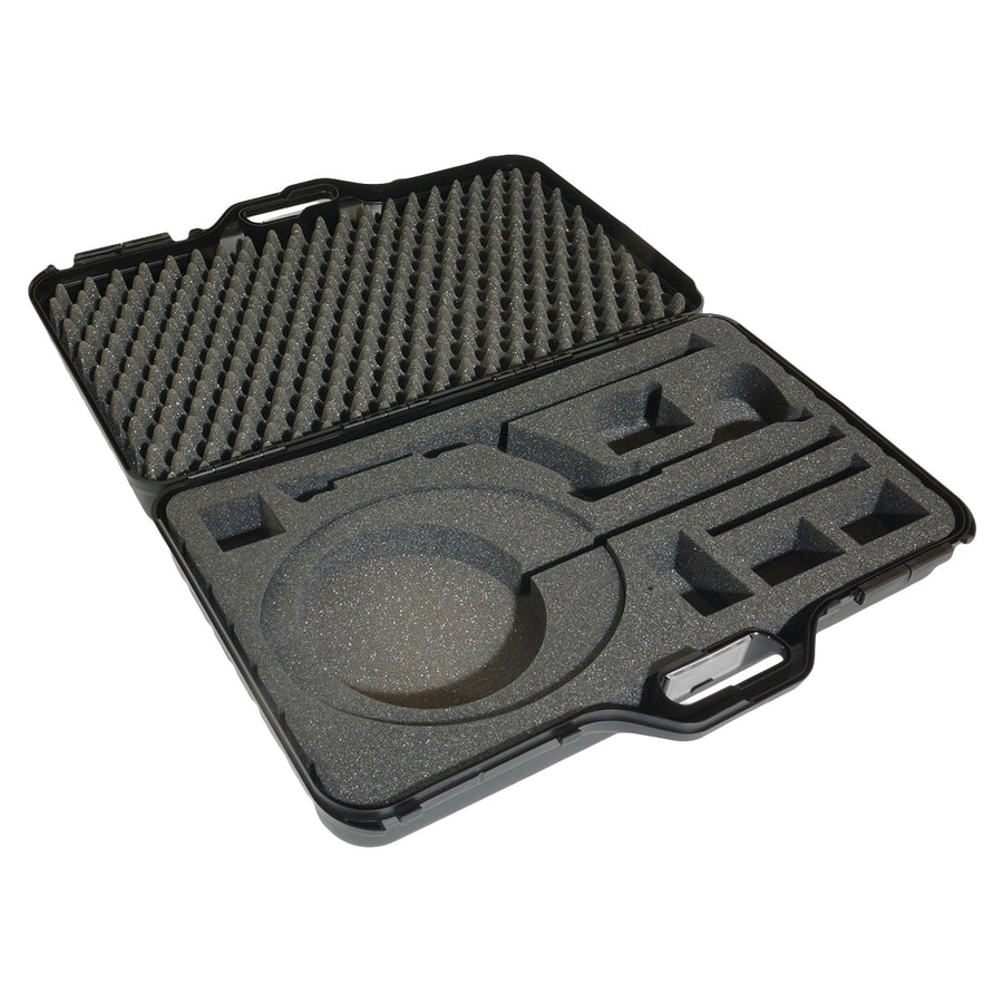 XP hard transport case open, showing the precision-cut foam insert with cutouts for the detector, remote and three coils