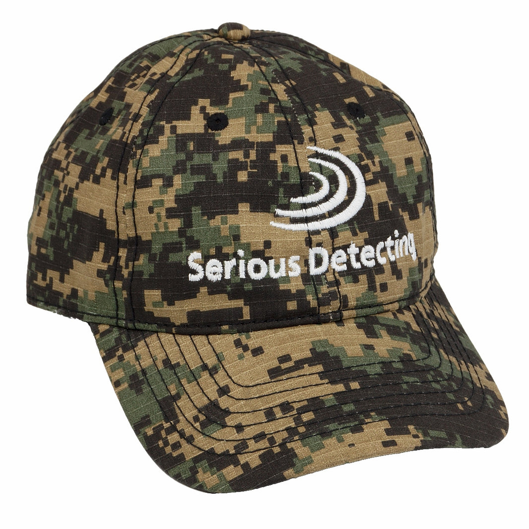 A camouflage baseball cap with the embroidered Serious Detecting logo on the front.